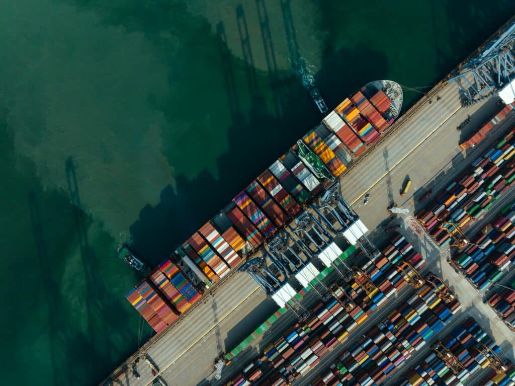 Aerial view of ship docking at container terminal